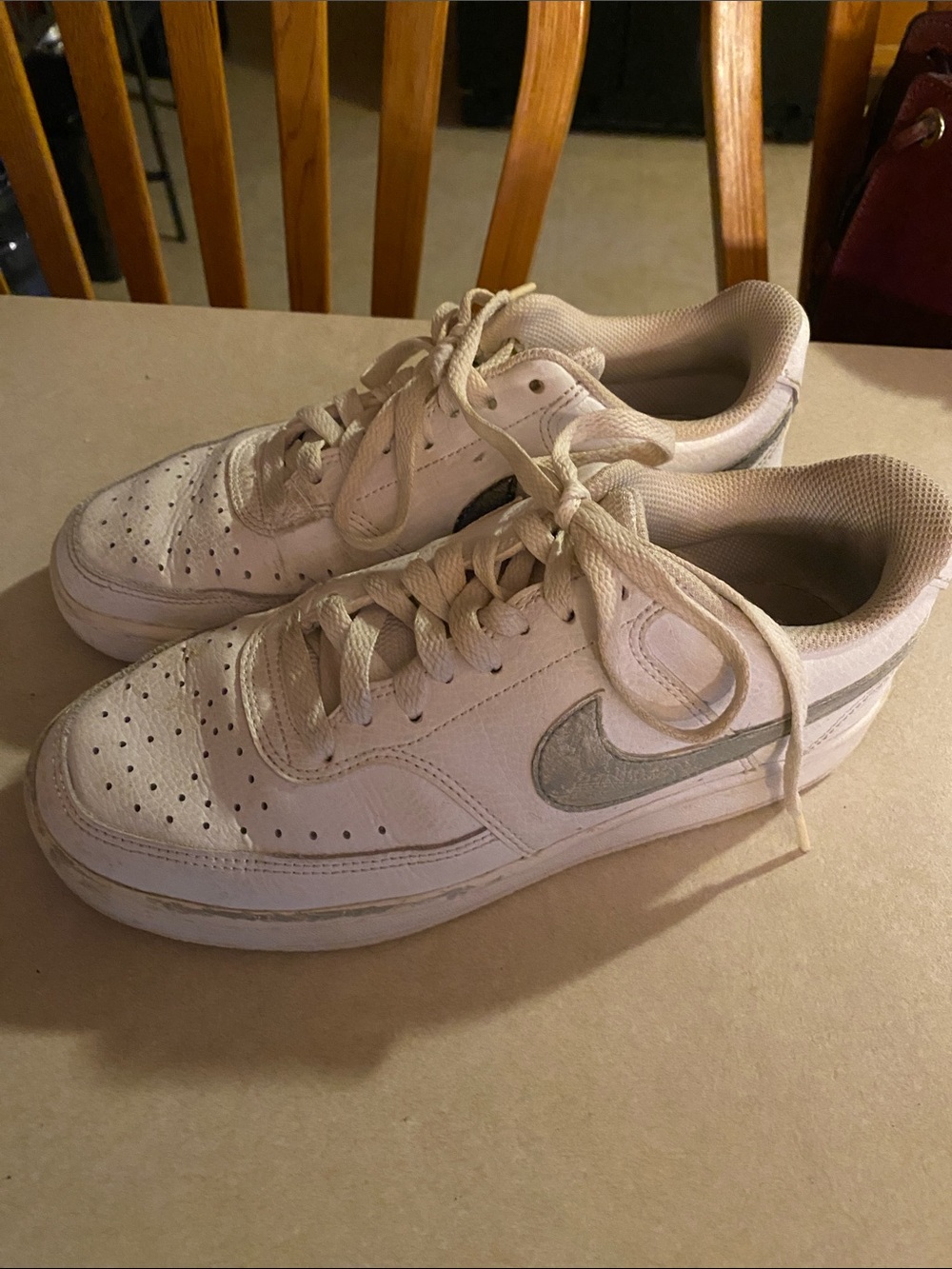 Nike White Low-Top Sneakers with Silver Swoosh